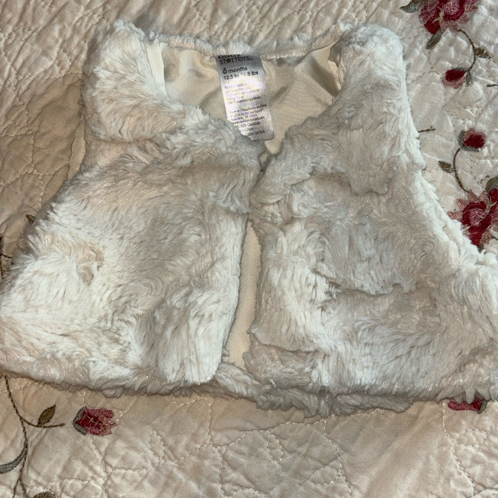 Baby’s Vest. With a one button do up. Very soft